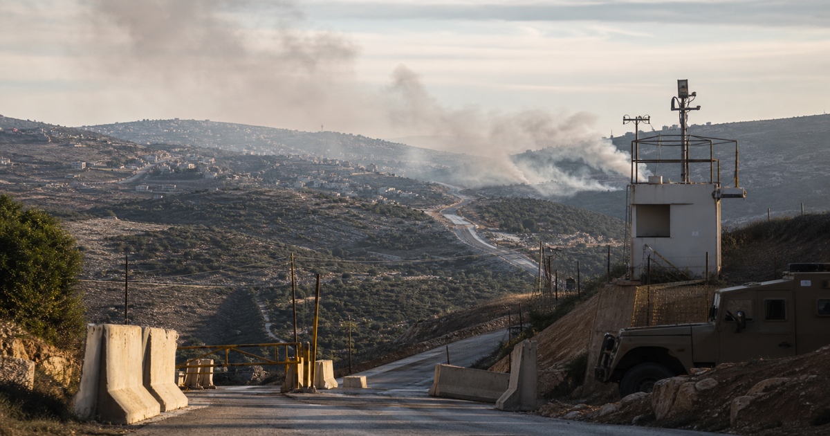 Southern Lebanon border road and distant smoke